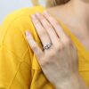 Love Story with the Rhodium-Plated Sterling Silver Princess Cut 3-Stone CZ Engagement Ring - A Timeless Symbol of Love and Commitment