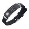Close-up of a silicone medical alert bracelet with black adjustable straps and a sleek stainless steel tag featuring custom engraving options. 