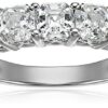 Close-up of a platinum-plated sterling silver ring featuring five Asscher-cut Swarovski Zirconia stones in a timeless 5-stone setting, displayed on an elegant jewelry box. 