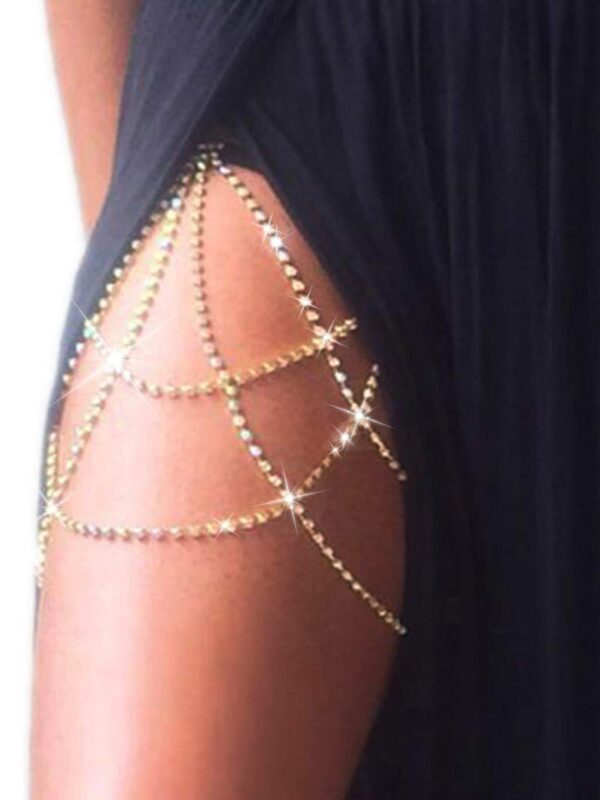 A sparkling gold and crystal leg chain displayed elegantly on a thigh, showcasing its adjustable design and shimmering details perfect for festive or glamorous events. 